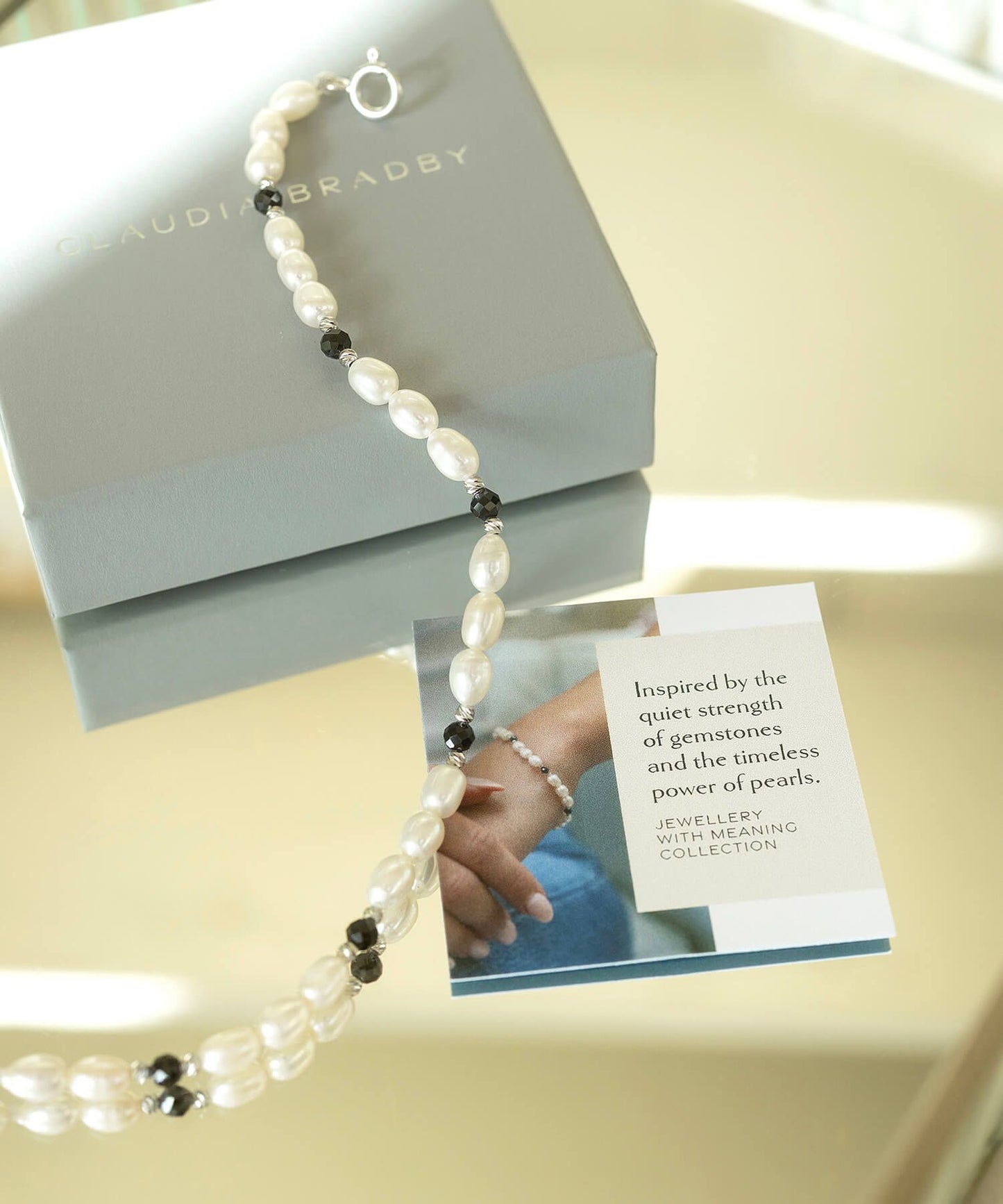 Black and White Pearl Positivity silver Bracelet with story card