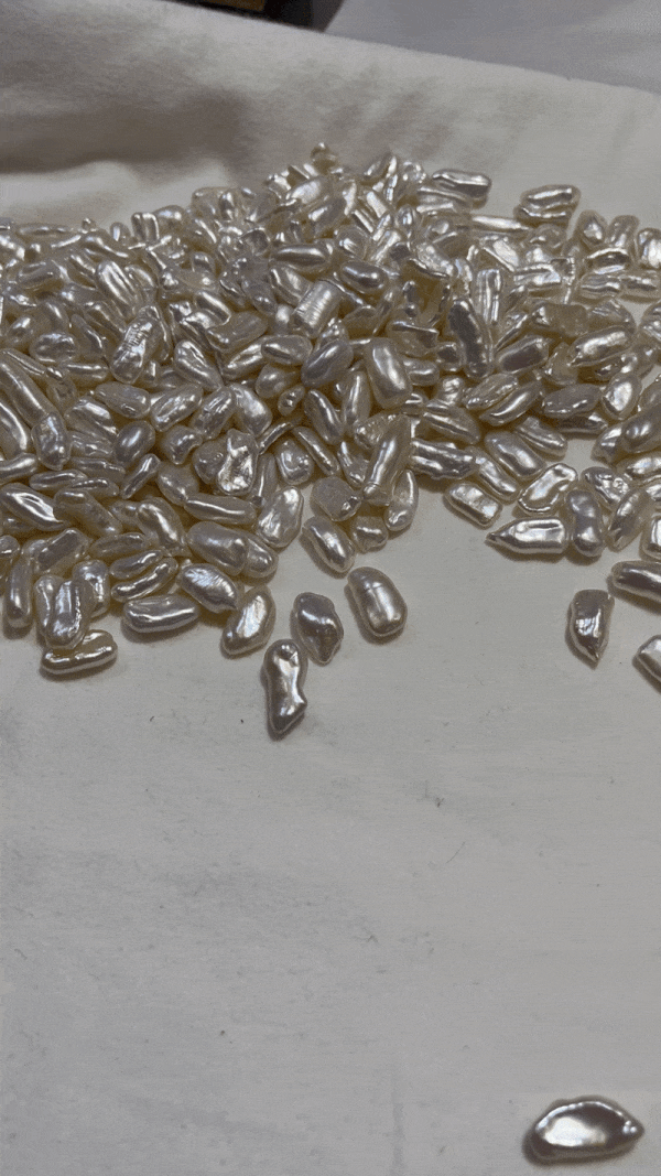 claudia hand selecting unique freshwater pearls