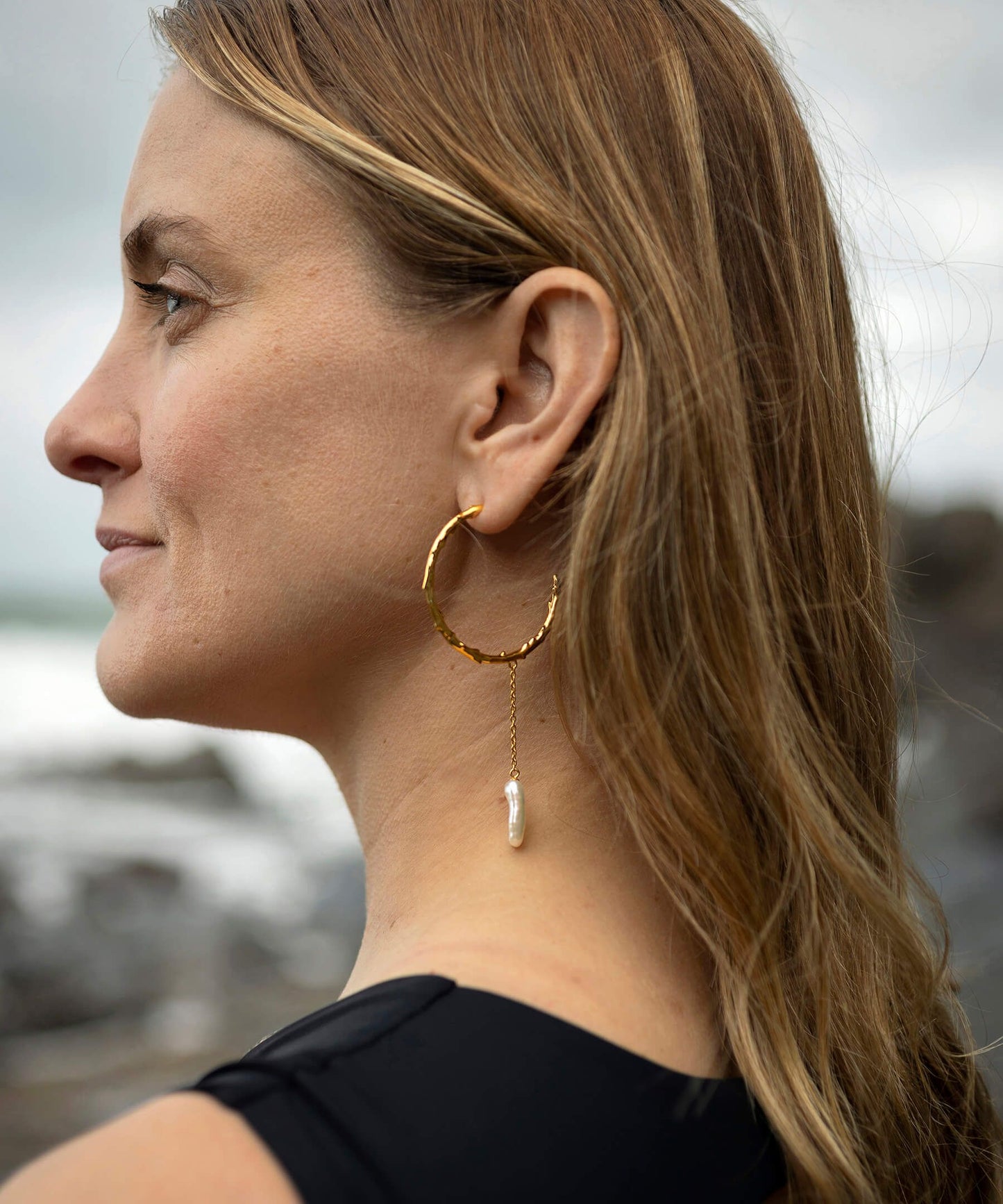 Large volcano hoop gold earrings with long biwa pearl drop