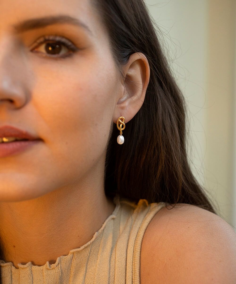 Medium love knot pearl gold drop earrings