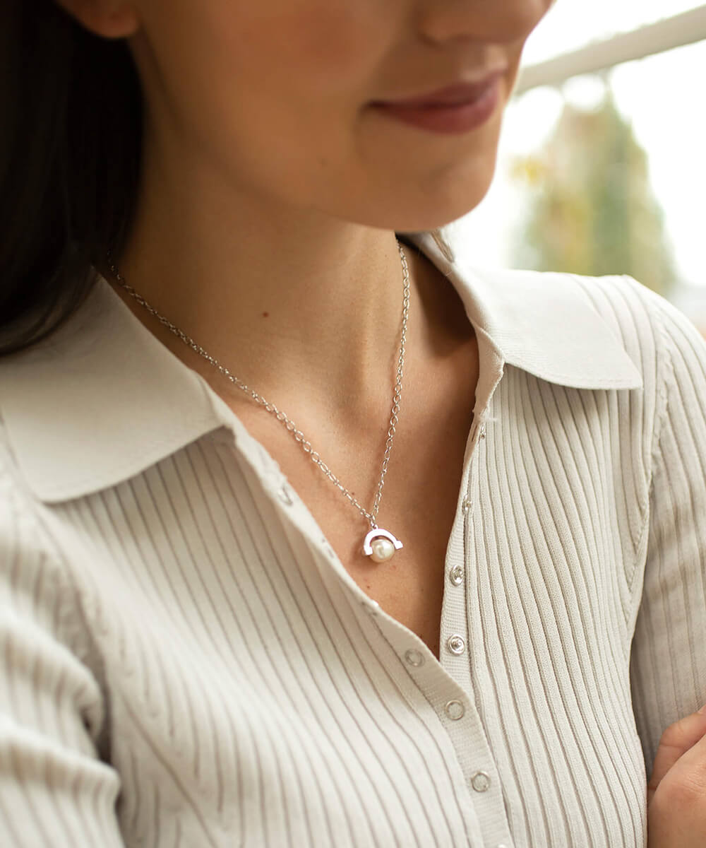 Meditative silver pearl spinner necklace