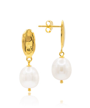 Gold earrings with white pearls on a white background