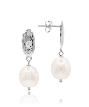 Pearl earrings with silver hooks on a white background