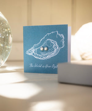 The World Is Your Oyster gift card with pearl studs