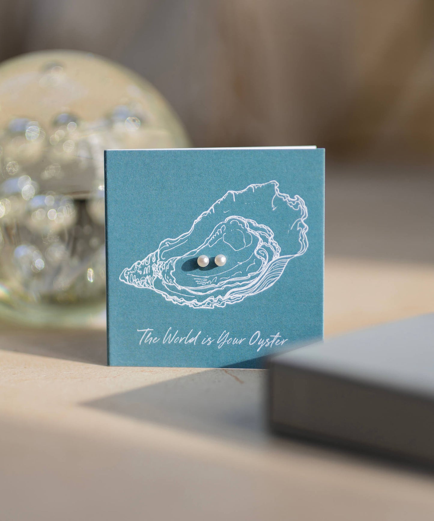 The World Is Your Oyster gift card with pearl studs