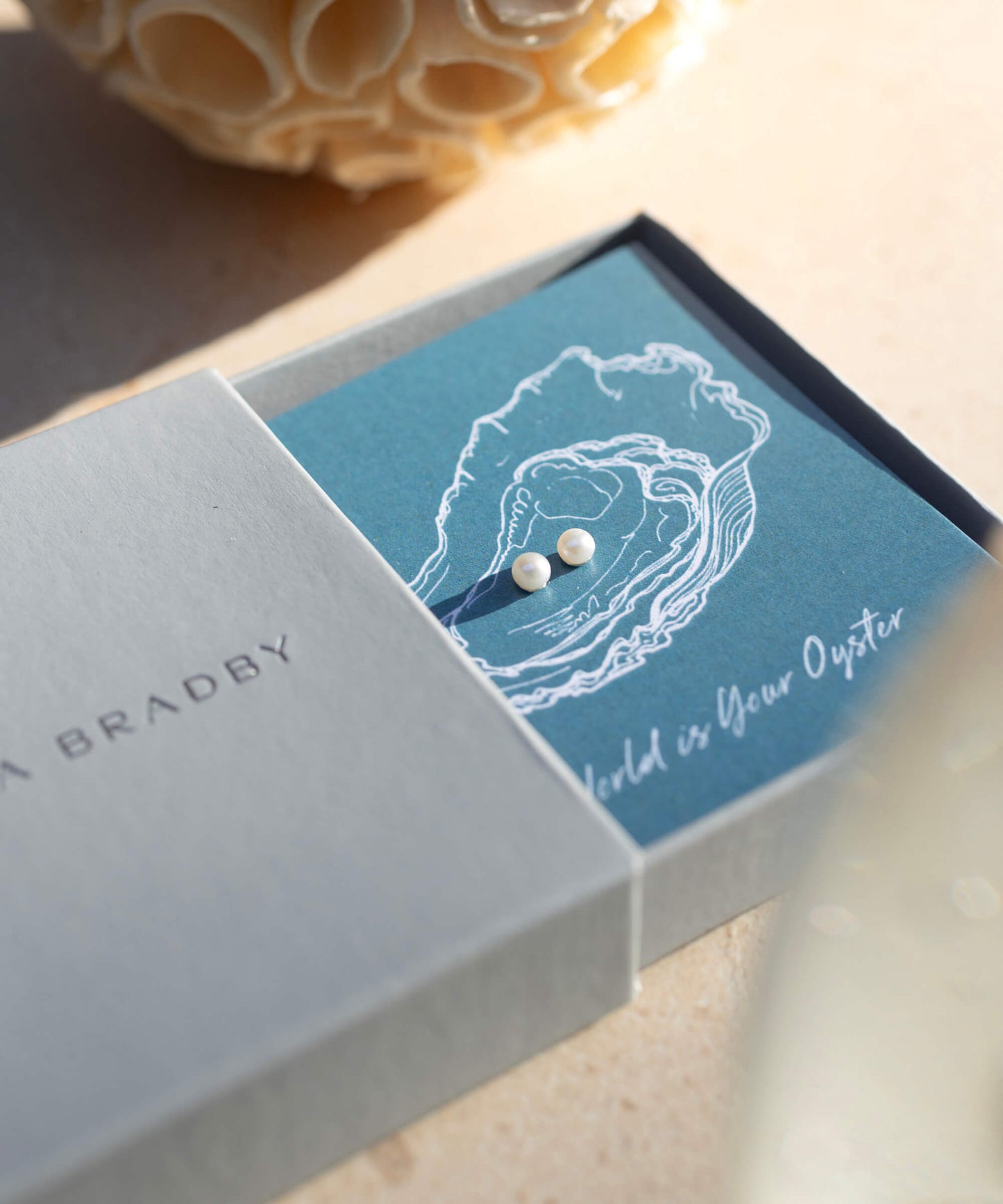 The World Is Your Oyster gift card with pearl studs