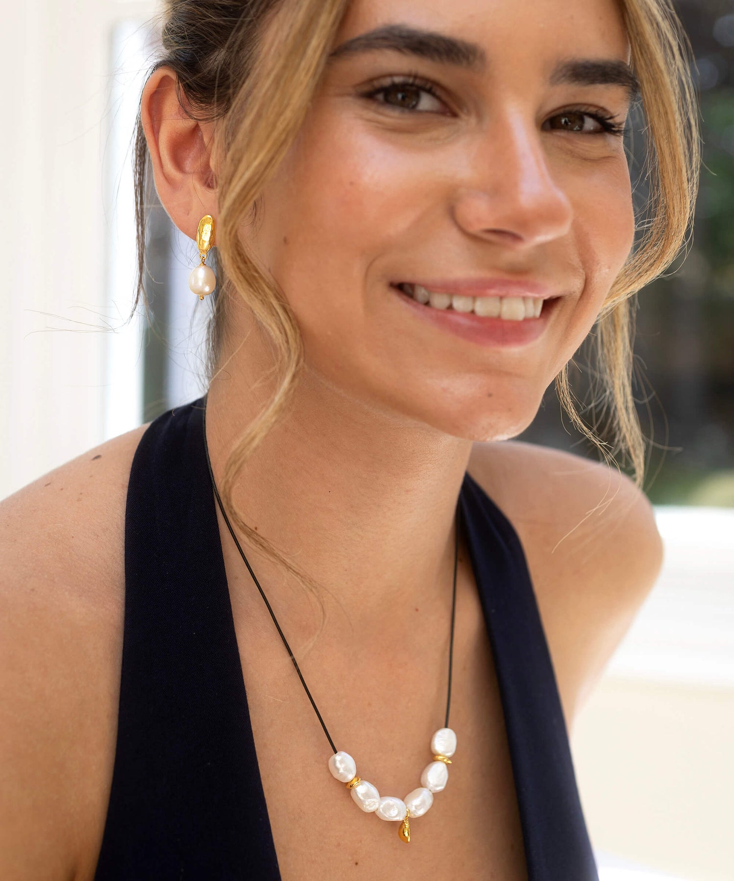Large Baroque pearl and gold charm necklace, on adjustable cord