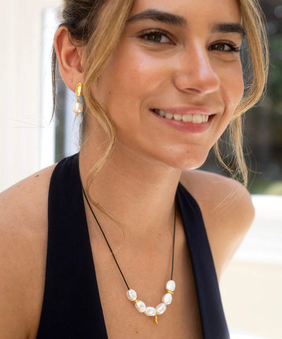 Large Baroque pearl and gold charm necklace, on adjustable cord