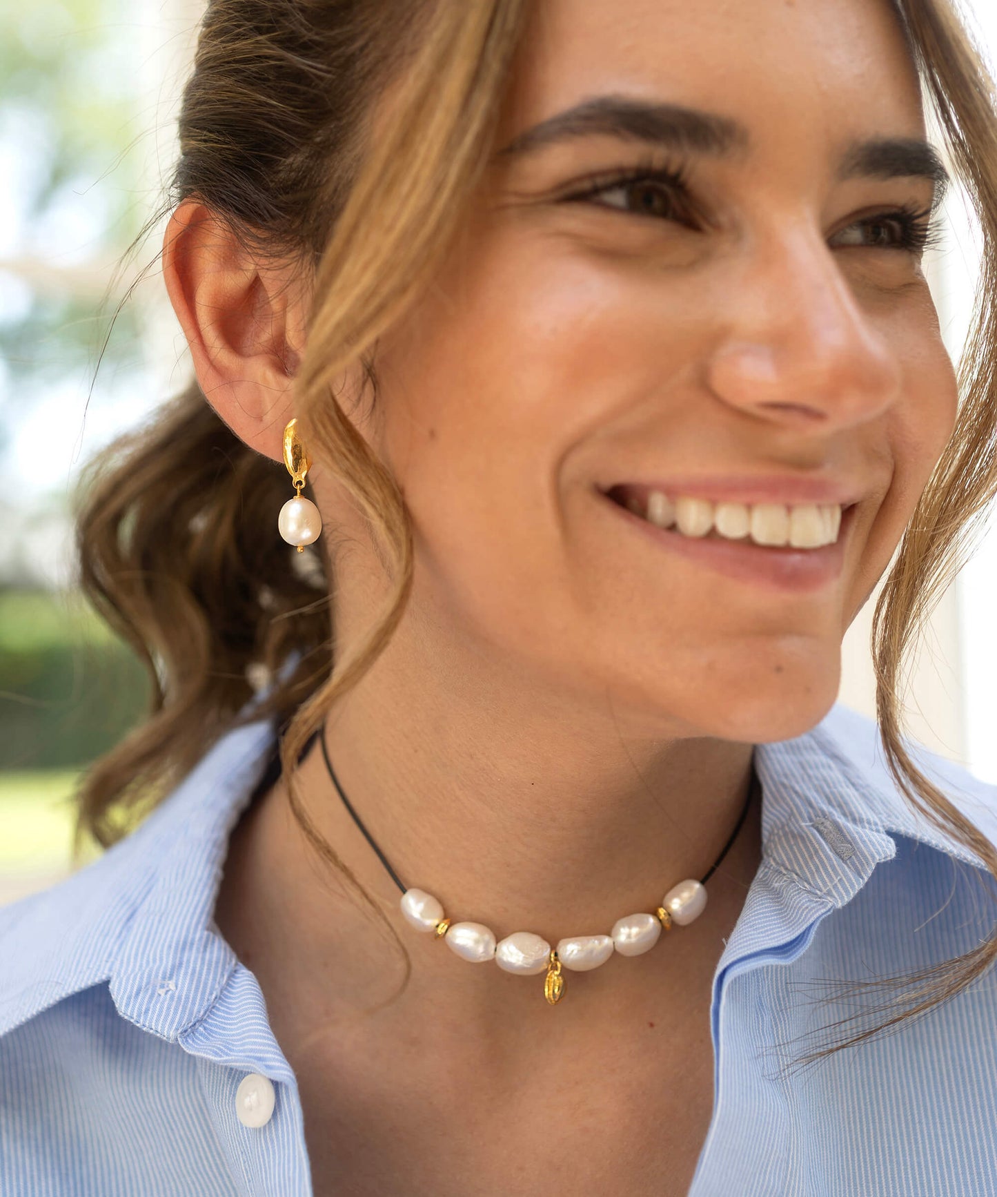 Large Baroque pearl and gold charm necklace, on adjustable cord
