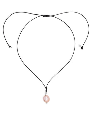 Necklace with a pink pearl pendant on a white background