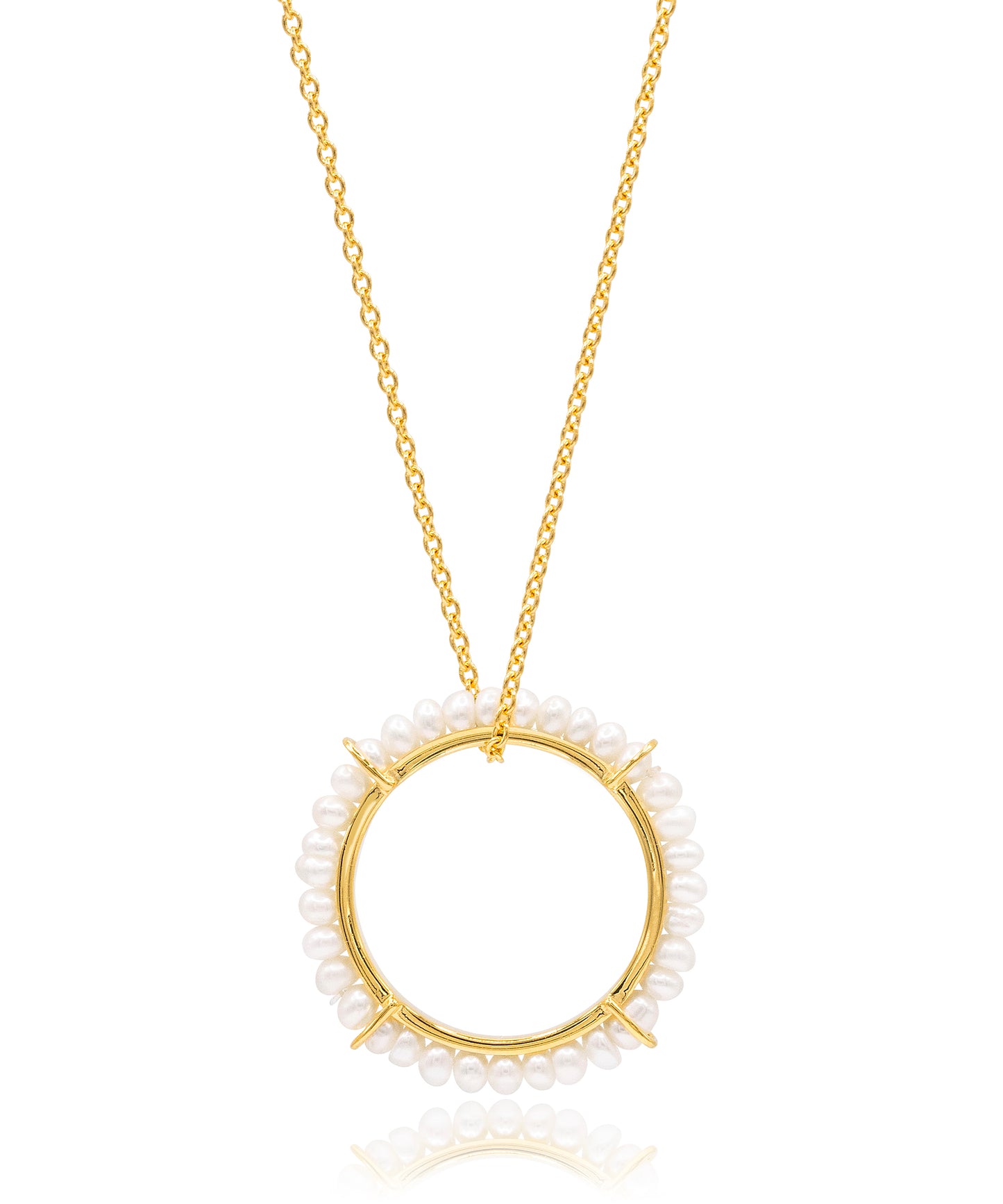 Gold necklace with a circular pendant featuring small pearls on a white background