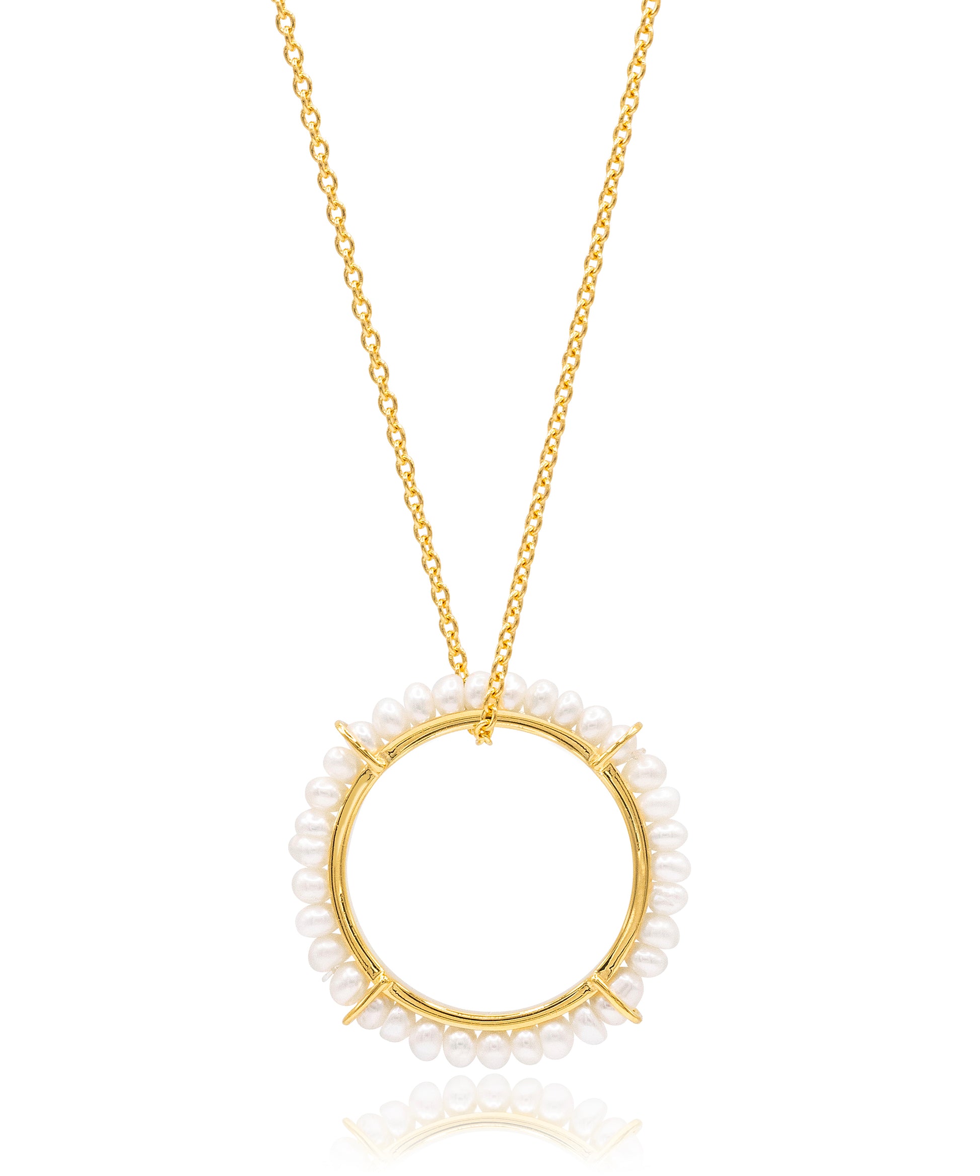 Gold necklace with a circular pendant featuring small pearls on a white background