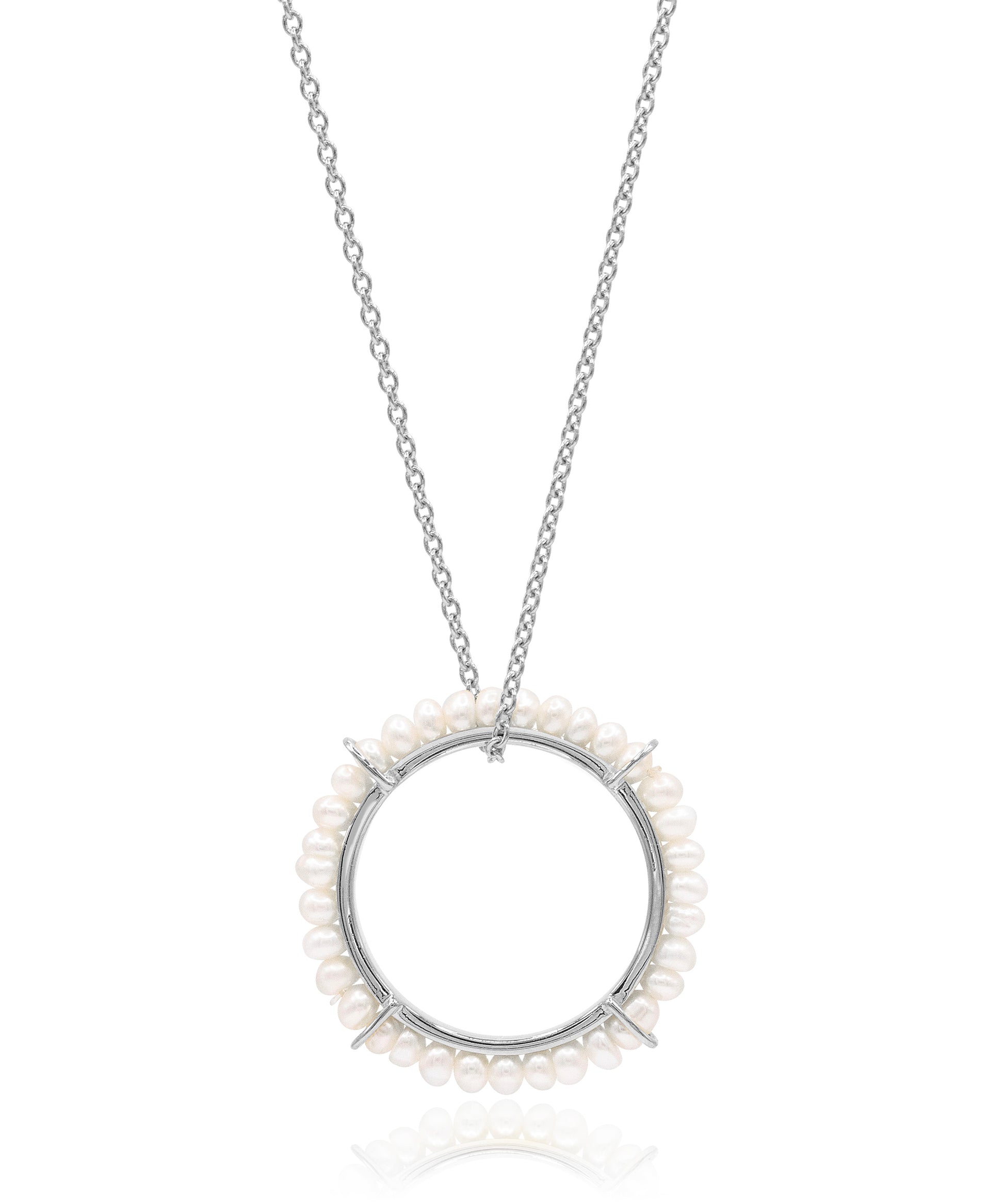 Silver necklace with a circular pendant featuring small pearls on a white background