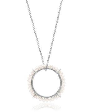 Silver necklace with a circular pendant featuring small pearls on a white background