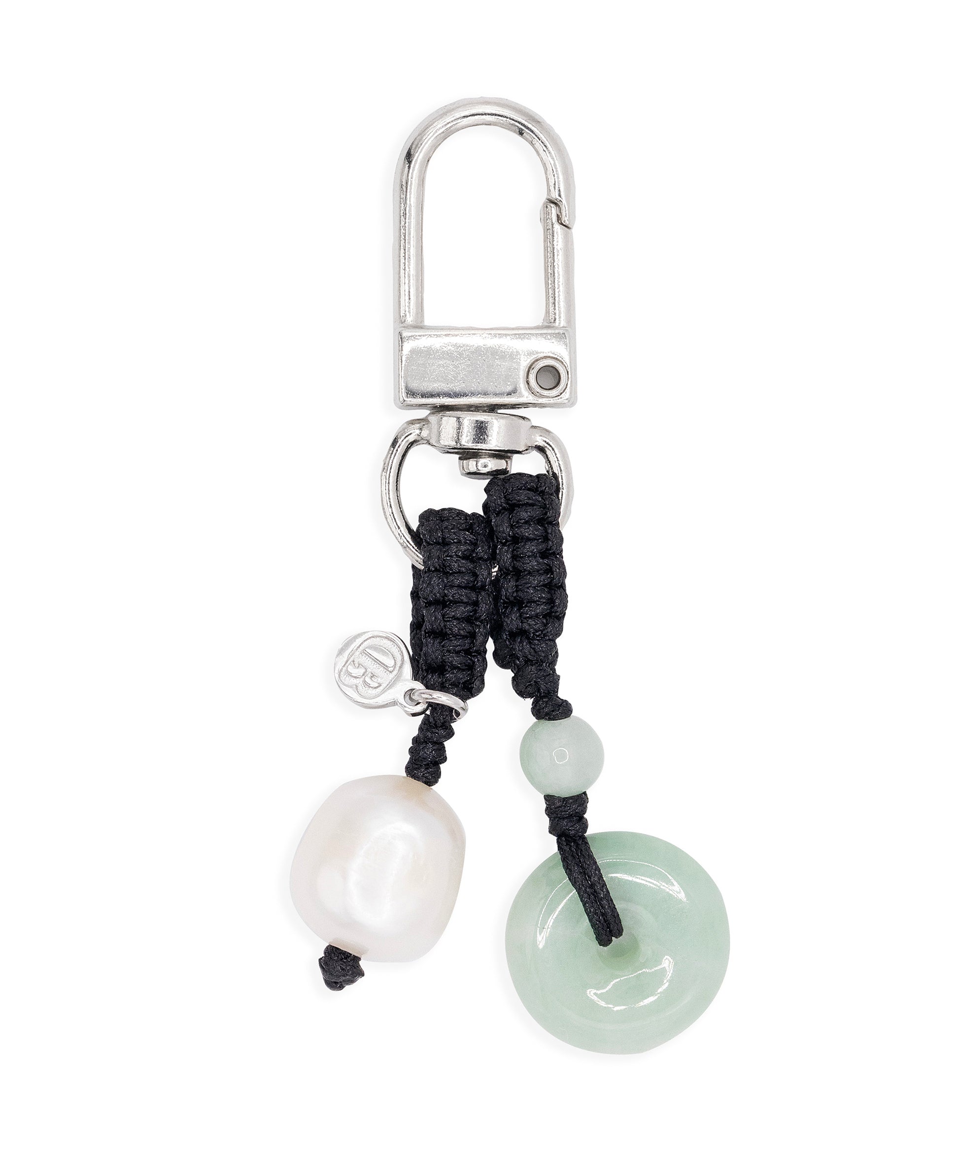 Keychain with black cord, pearl, and jade charm on a white background