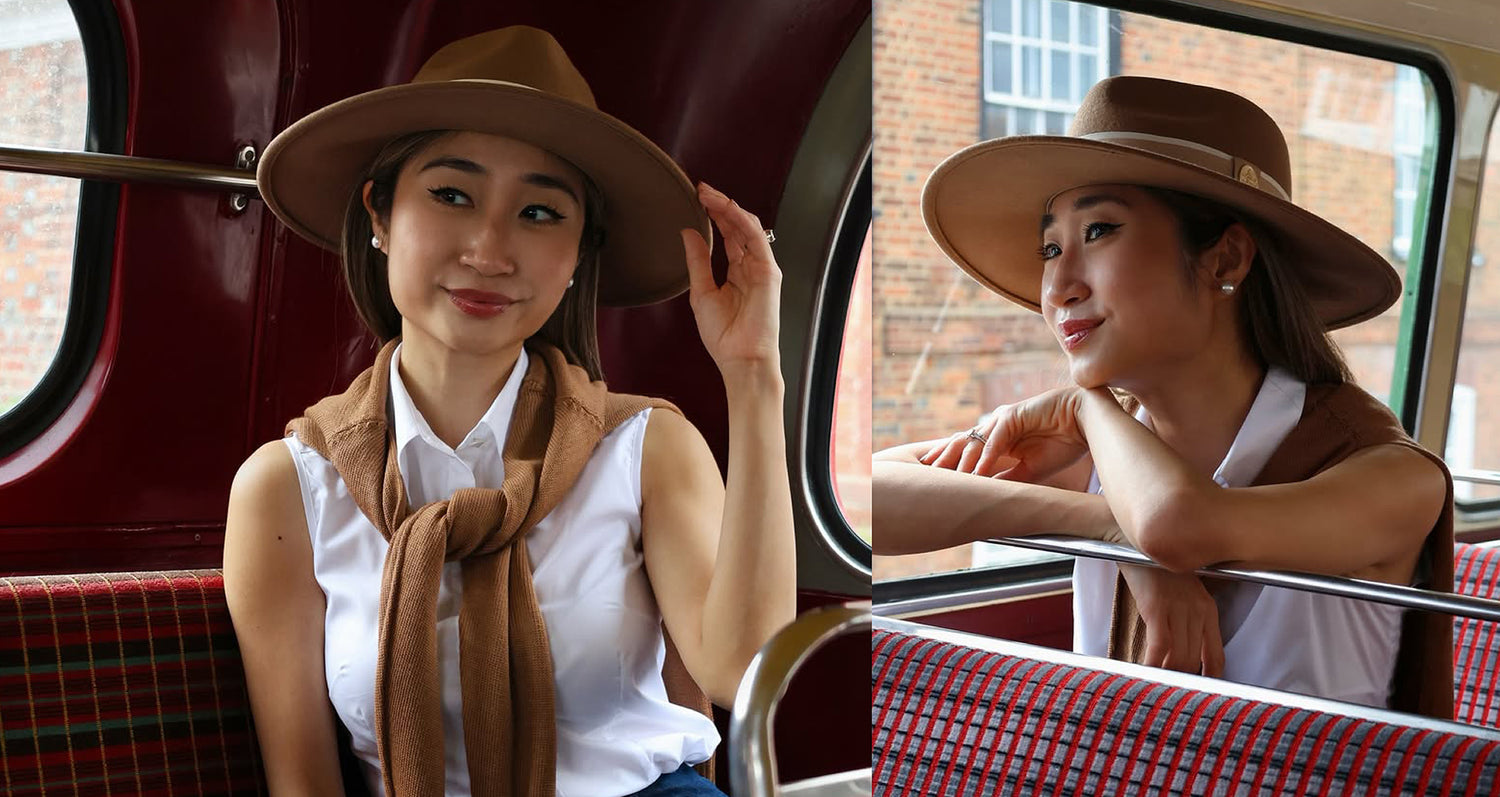 Woman wearing a brown hat and scarf on a bus, with a side view of her sitting inside.
