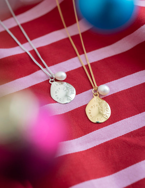 bestselling world is your oyster necklace in gold and silver