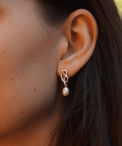 Medium love knot pearl drop earrings, silver